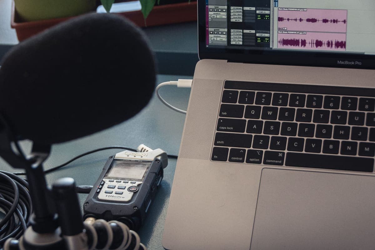 A podcast microphone connected at a desk workstation