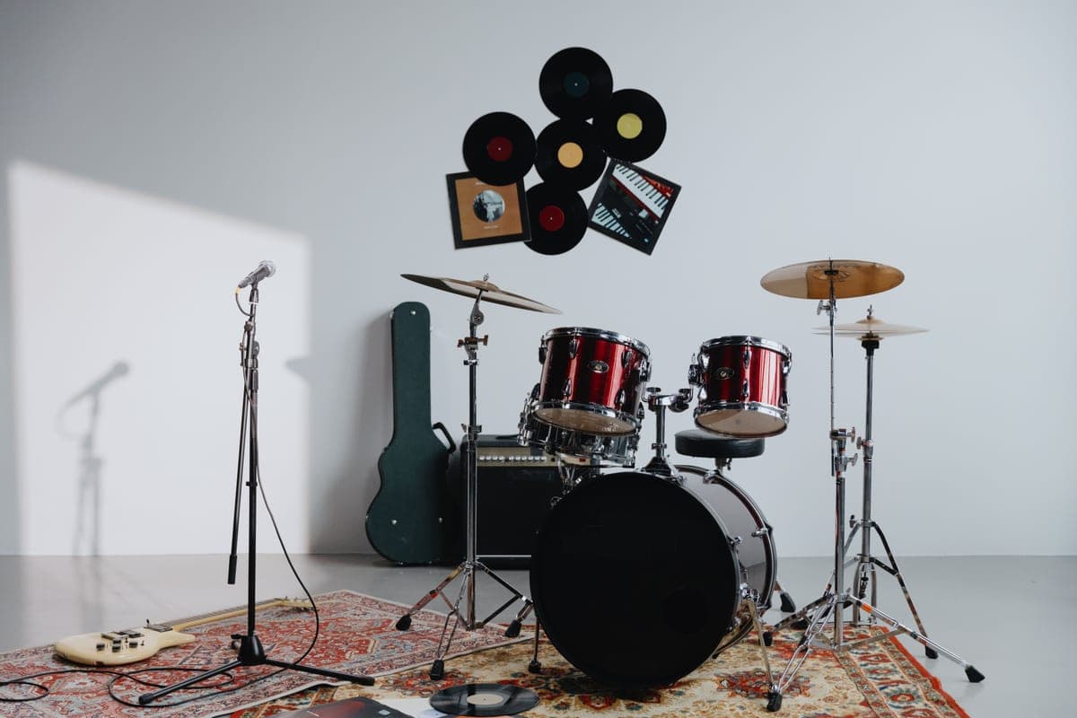 A floor microphone stand with a telescopic boom in a recording room